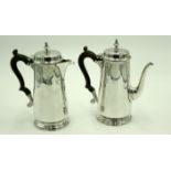 A silver Elkington & Co bachelor's coffee pot with matching hot water jug in mid 18th century style.