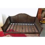 A Chinese style double bergere cane and simulated bamboo daybed, width 200cm, depth 102cm.