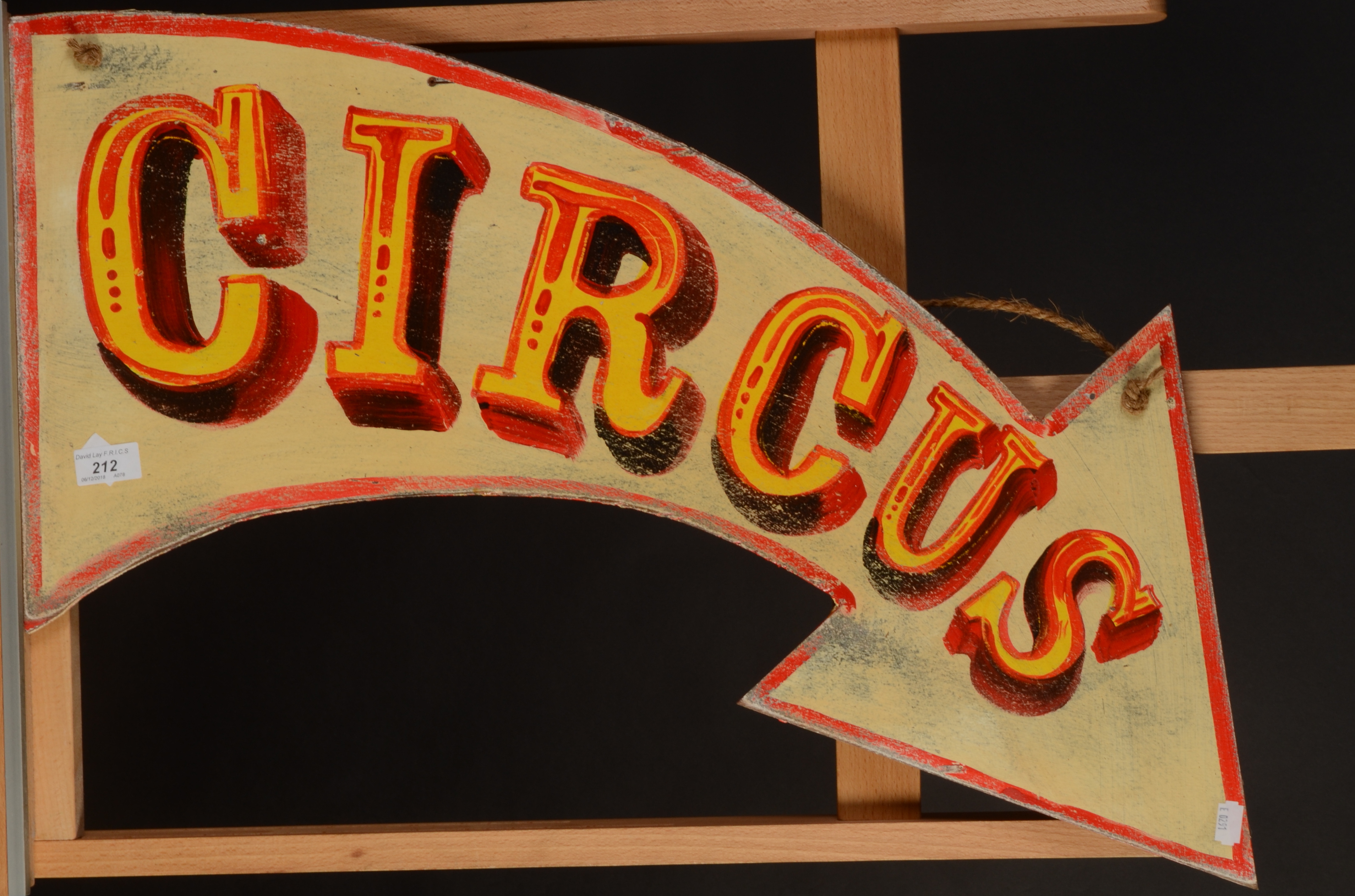 A small 'Circus' sign in the shape of an arrow, maximum width 70cm.