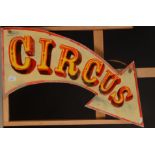 A small 'Circus' sign in the shape of an arrow, maximum width 70cm.