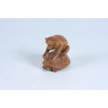 A Japanese carved wood netsuke of a monkey on a turtle's back, signed, height 4.5cm, width 3.