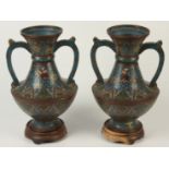 A pair of Chinese cloisonne twin handled vases, 19th century, seal mark to base, height 31cm,