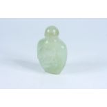 A jade snuff bottle carved with hares and pak choi rabbits, height 9cm.