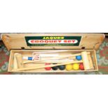 A Jaques croquet set, with five mallets, seven balls and six metal hoops, in a pine box.
