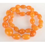A good string of graduated amber beads, the largest bead 30 x 22mm.