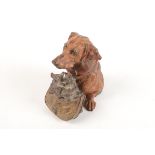 A cold painted spelter inkwell in the form of a dog with her puppies, height 12.5cm.