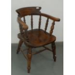 An elm and beech captain's armchair, circa 1900,