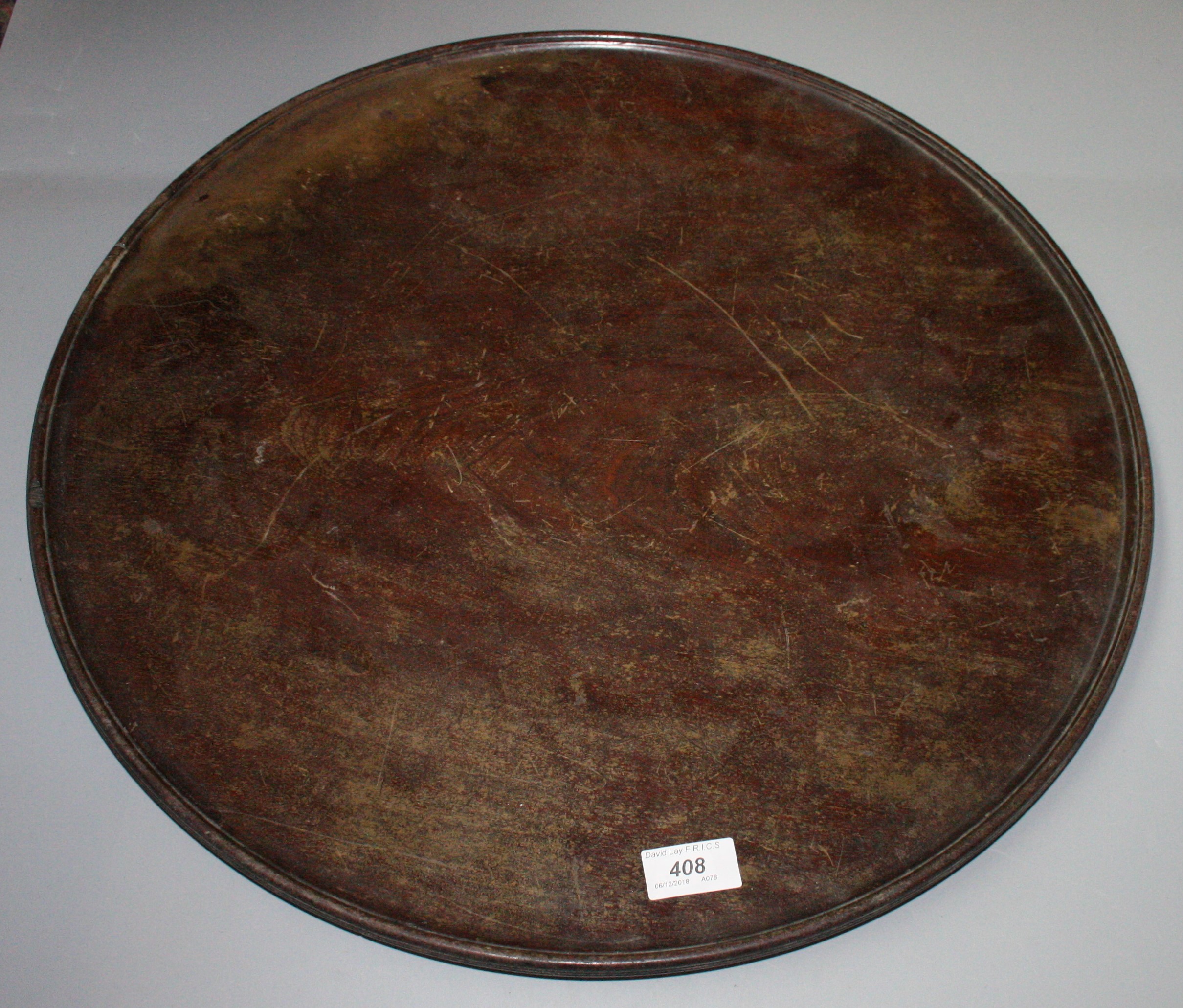 A mahogany circular tray, early 19th century, diameter 53.3cm.