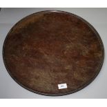 A mahogany circular tray, early 19th century, diameter 53.3cm.