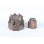 Two copper jelly moulds, height 7.5cm, diameter 9.8cm and height 5.5cm, diameter 5.7cm.