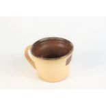 A Leach pottery mug, inscribed 1920, 2010, height 7.5cm, diameter 10.5cm.