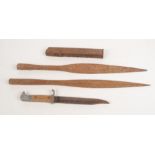 Two African spearheads, length 52cm, a bayonet and a magazine.