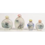 Four Chinese glass snuff bottles, interiors painted with landscape and river scenes, highest 8.6cm.