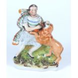 A Victorian Staffordshire group of a man fighting with a lion, height 25.5 cm.