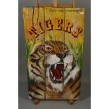 A wooden sign painted with a growling tiger,