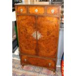 A 1930s walnut tallboy,