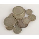 An 1887 silver shilling and about approximately 50p face value pre 1947 silver coins.