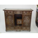 A Chinese hardwood cabinet, circa 1900, profusely inlaid with mother of pearl,