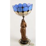 A gilt metal table lamp in the form of a lady with Tiffany style glass shade, height 64cm,
