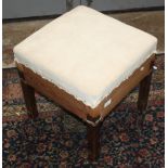 A Danish mahogany stool, mid 20th century, with a padded seat on square section legs, height 43cm,