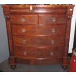 A Victorian mahogany veneered bow front Scotch chest with glass knobs, width 125cm, height 140cm.