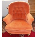 A Victorian upholstered tub armchair, with turned tapering oak legs, height 93cm.