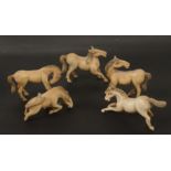 Five ivory figures of horses, circa 1900.