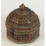 An Islamic bronze incense burner, with a pierced body and cover, height 14.5cm, width 13cm.