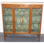 An Edwardian satinwood display cabinet with three glazed doors,