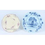 A English tin glazed plate, blue and white painted with a Chinese scene,