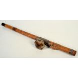 A Chinese bamboo opium pipe, 19th century, carved with a frog,
