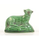 A 18th century green Whieldon type pottery recumbent sheep, width 5.5 cm.