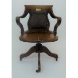 An oak swivel office chair,