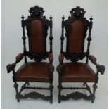 A pair of late 19th century Flemish ornate high back armchairs, with lions heads,