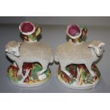 A pair of late Victorian Staffordshire sheep spill figures.