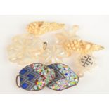 An enamel buckle, mother of pearl pendants and a pair of carved ivory pendants.