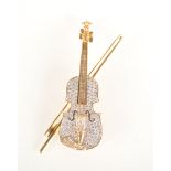 An impressive violin and bow 18ct gold diamond brooch,