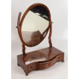 A mahogany serpentine dressing table mirror, 19th century,