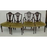 A set of three Hepplewhite style dining chairs, with carved shield back,