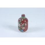 A red cloisonne snuff bottle, height 6cm.