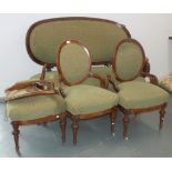 A Victorian burr walnut drawing room suite, 19th century, comprising a sofa and four armchairs,