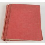 A red canvas bound scrapbook covering a variety of subjects to include,