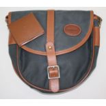 A Barbour tote bag, navy oil cloth outer with tan leather trim and navy check lining, 23 x 24cm,