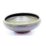 A Brett Guthrie Leach stoneware shallow bowl, with greenish tenmoku glaze, impressed seals,