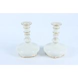 A pair of Royal Worcester Grainger & Co candle holders, shape no 280, height 15.5cm.