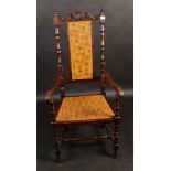 An oak open armchair, early 20th century, with a rattan covered splat and seat, height 127cm,