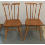 A pair of Ercol style stickback chairs.