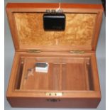 A wooden, brown leather covered humidor, 20th century, height 16cm, width 37.5cm, depth 23.2cm.