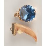 A 14ct gold mounted blue stone pendant and a gold mounted crab claw pendant.
