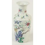 A Chinese famille rose porcelain baluster vase, 19th century, decorated with a flowering tree,